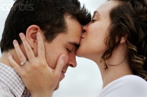 Woman Kissing a Man's Forehead